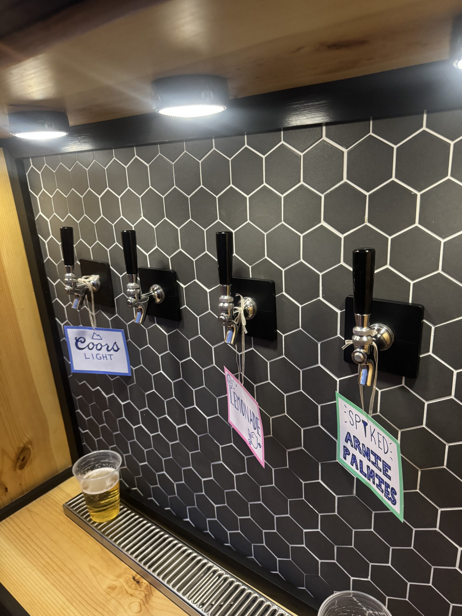 Four beverage taps inside The Tapped Trailer